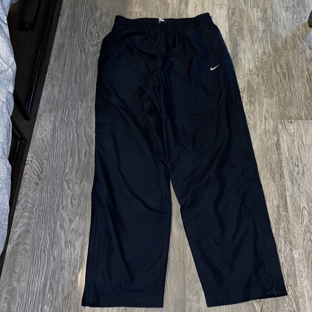 Nike sweat pants L blue gently used retail $95 zipper at ankles